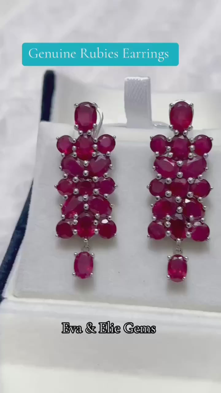 Dazzling cascading genuine ruby and clear stone drop earrings.