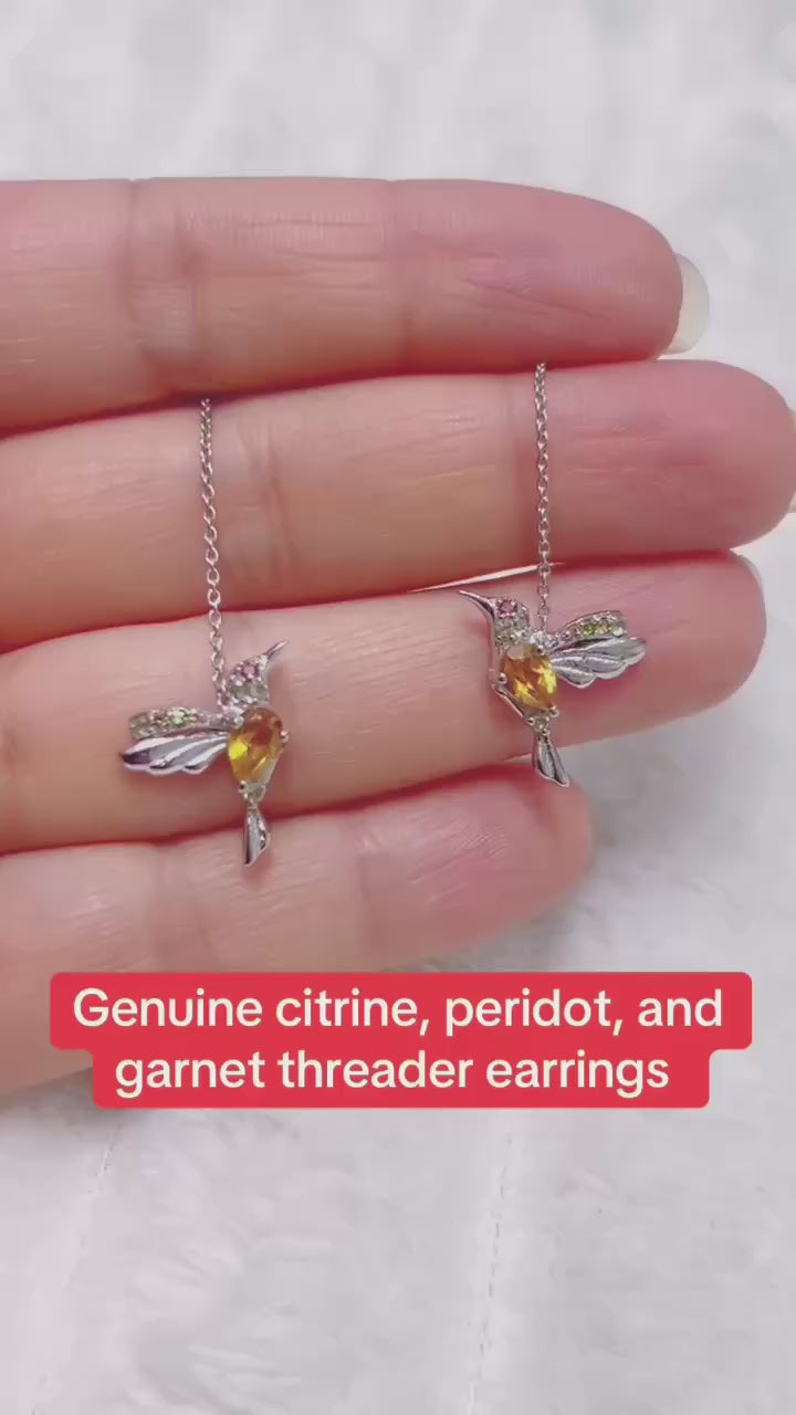 A unique pair of dangle earrings featuring natural citrine and peridot gemstones in a dropside design.