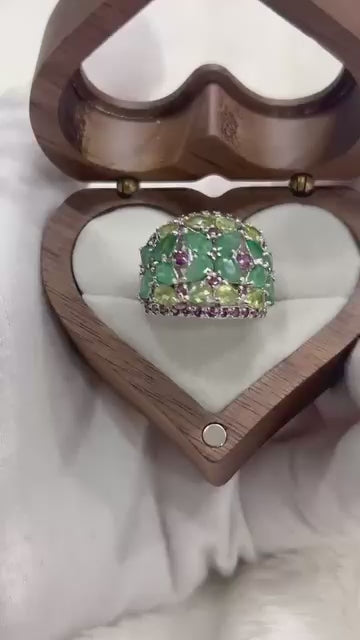 Stunning statement ring with genuine emerald, peridot, and rhodolite garnets.