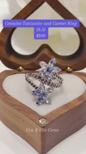  An elegant sterling silver ring featuring a vibrant combination of tanzanite and rhodolite.