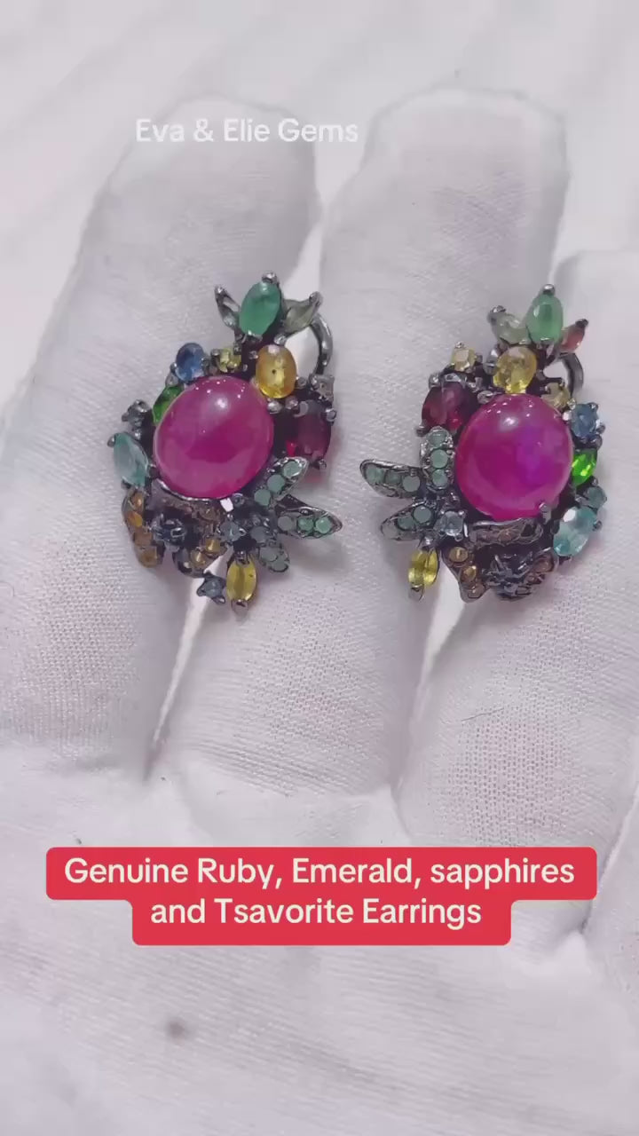 Handmade earrings featuring a stunning combination of genuine ruby, emerald, sapphire, and tsavorite gemstones.