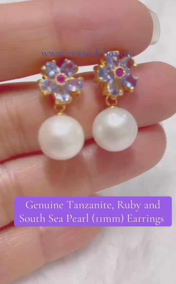 Genuine tanzanite, ruby, & South Sea pearl (11mm) floral drop earrings.