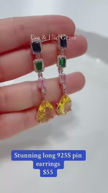 Long, fancy 925 sterling silver dangle earrings with a beautiful arrangement of colorful gemstones.