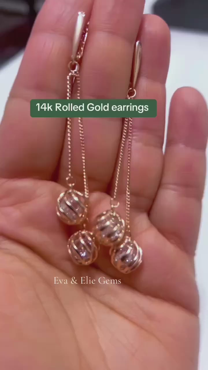 Modern 14k rolled gold earrings featuring natural zircons for subtle sparkle.