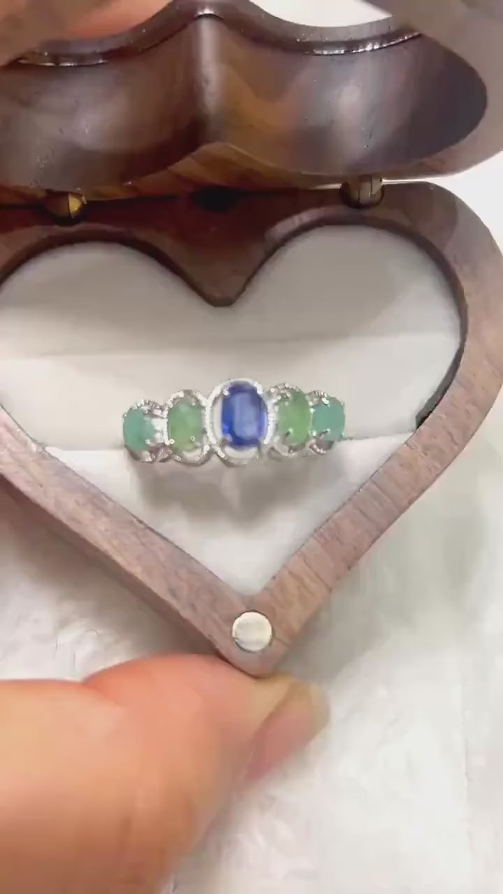 Exquisite multi-gemstone ring featuring Kyanite and Colombian Emeralds. Elegant and colorful.