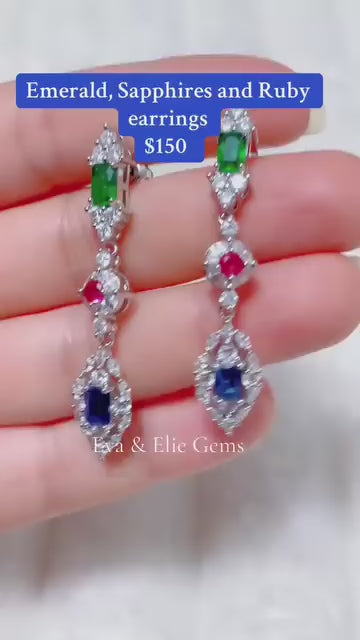 Vibrant ruby, emerald, and sapphire sterling silver drop earrings.