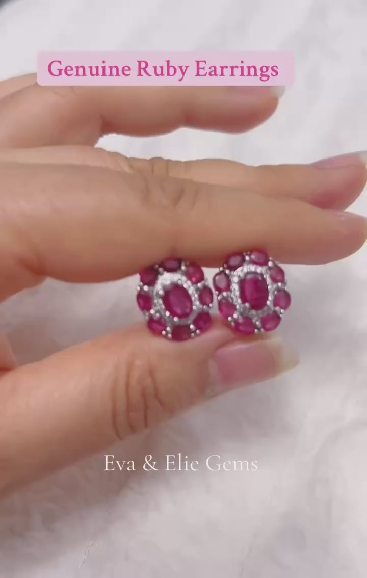  Genuine ruby halo stud earrings in white gold-plated sterling silver.