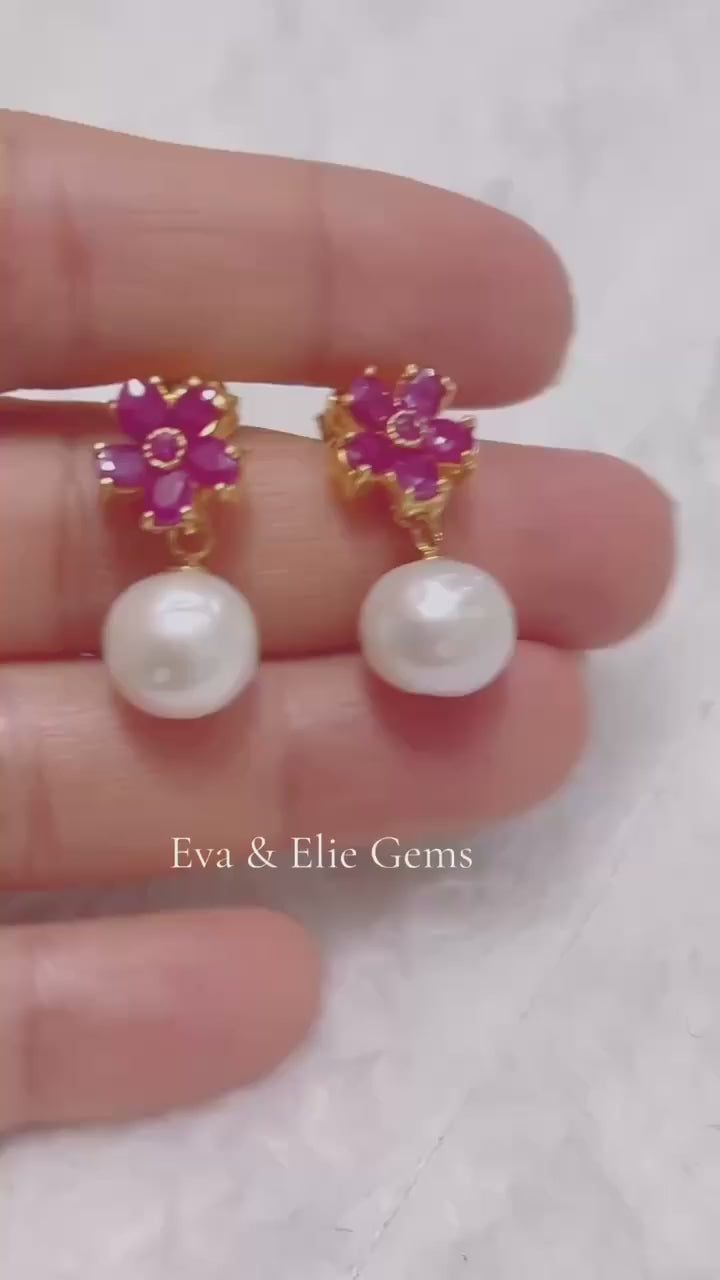 Elegant natural pink ruby and genuine South Sea pearl earrings.