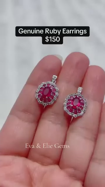 Dazzling ruby cluster earrings with shimmering clear accents, a vibrant statement piece.