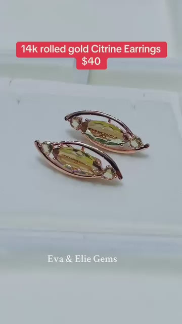 These exquisite earrings showcase a fancy design with a large, beautiful citrine stone.