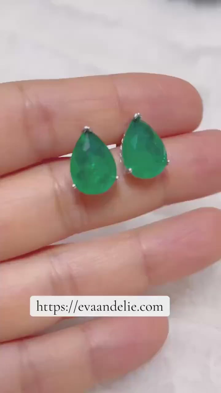 Stunning green Zambian emerald stud earrings with a elegant pear cut, ideal for adding a touch of color.