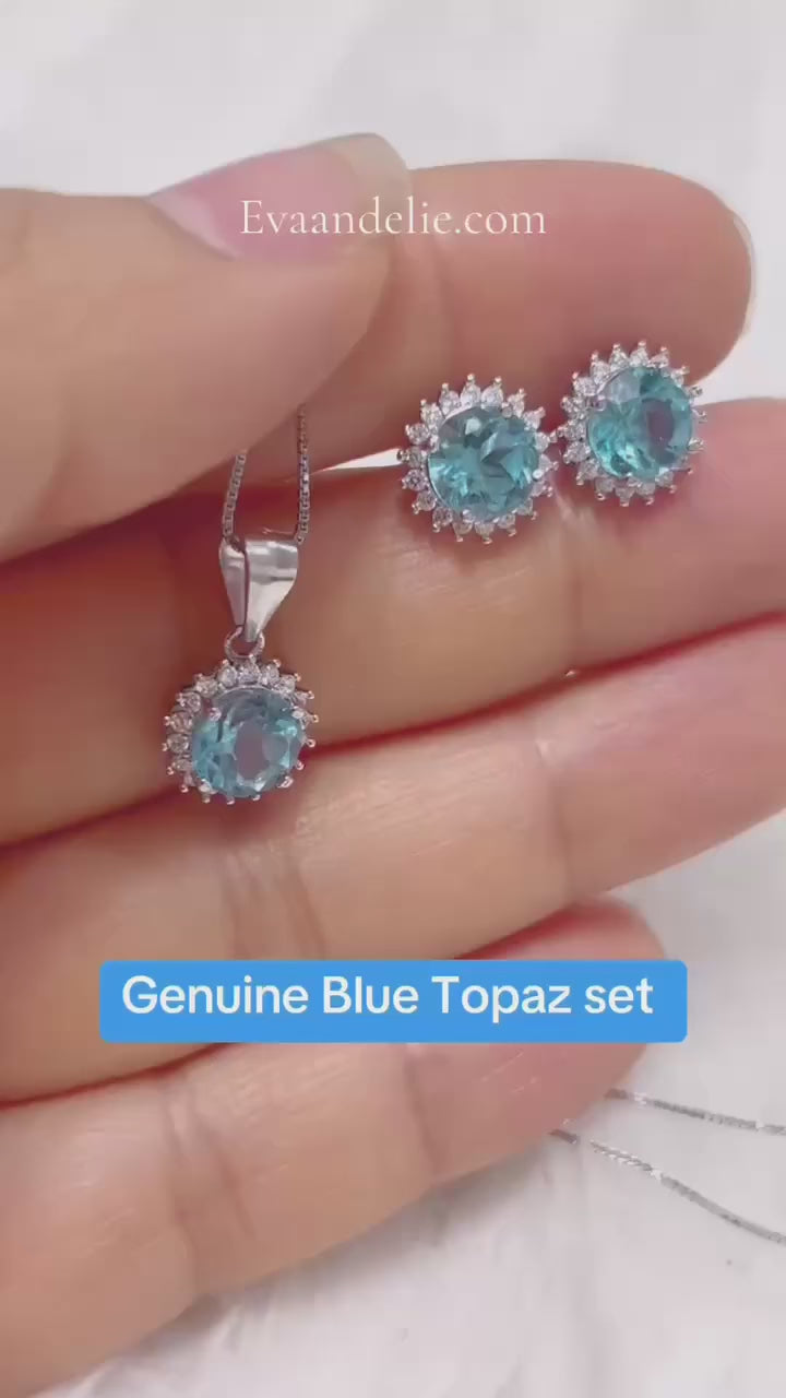 Elegant blue topaz and sparkling stone halo set, perfect for any occasion.