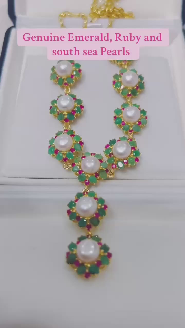  Genuine South Sea pearl necklace with natural Colombian emeralds and rubies.
