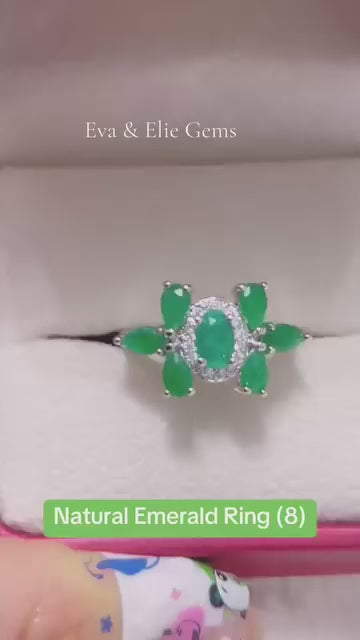 Natural emerald ring (size 8) with halo and side stones in sterling silver.