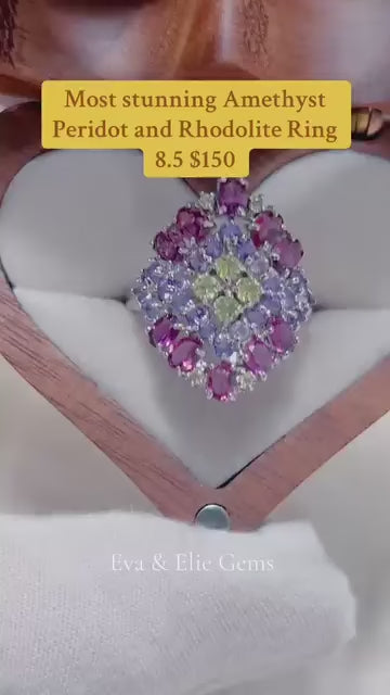 A stunning multi-gemstone ring with natural amethyst, peridot, and rhodolite stones.