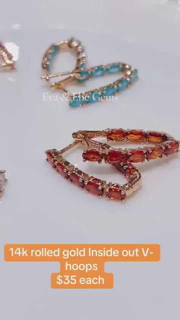 Stunning 14k rolled gold V-hoop earrings featuring colorful tourmaline.