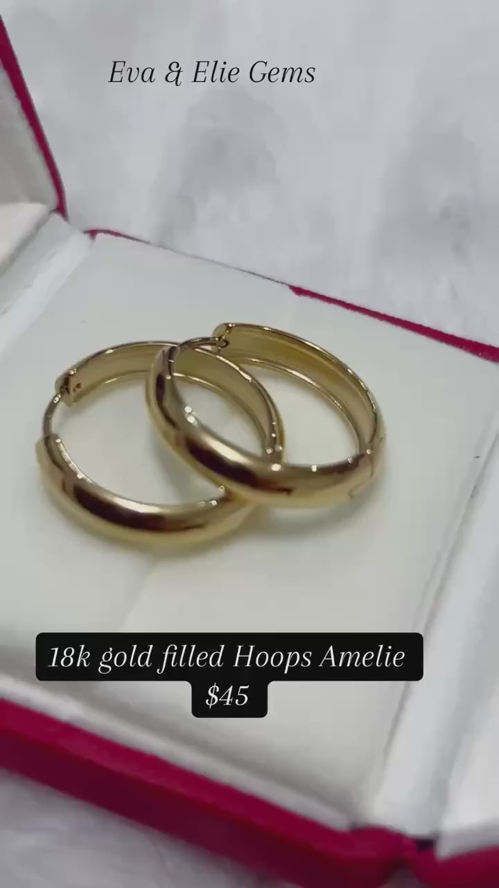 A simple yet elegant pair of Amelie gold hoops, versatile for any occasion.