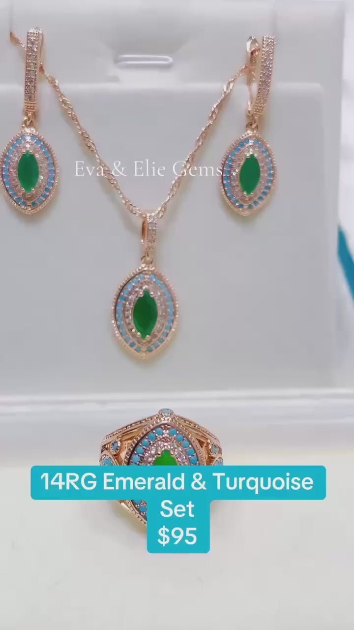 Gold-toned necklace and earrings set featuring a striking combination of emeralds and turquoise.