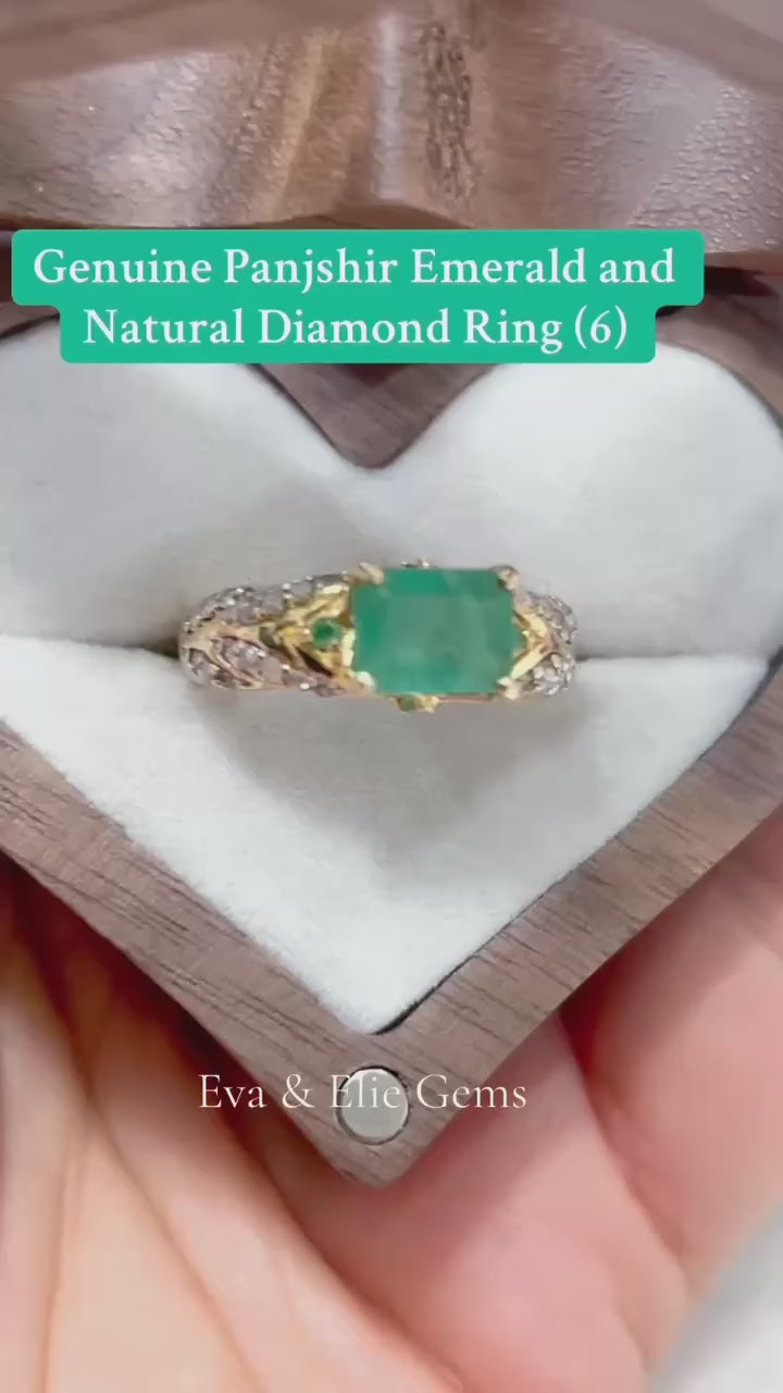 Elegant 18k gold-toned Colombian emerald and diamond ring.