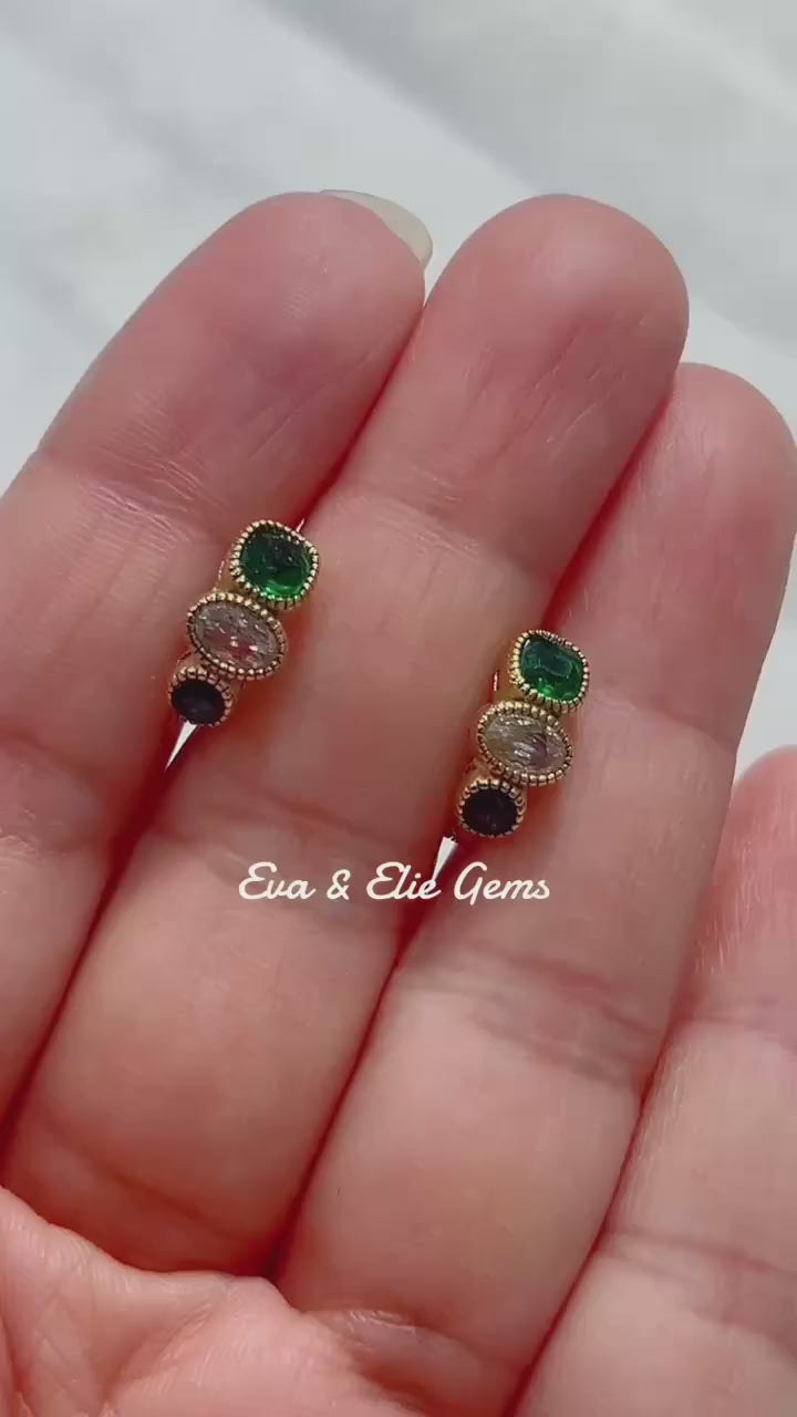 Beautiful 18k gold vermeil huggy earrings with a striking mix of green and blue gems.