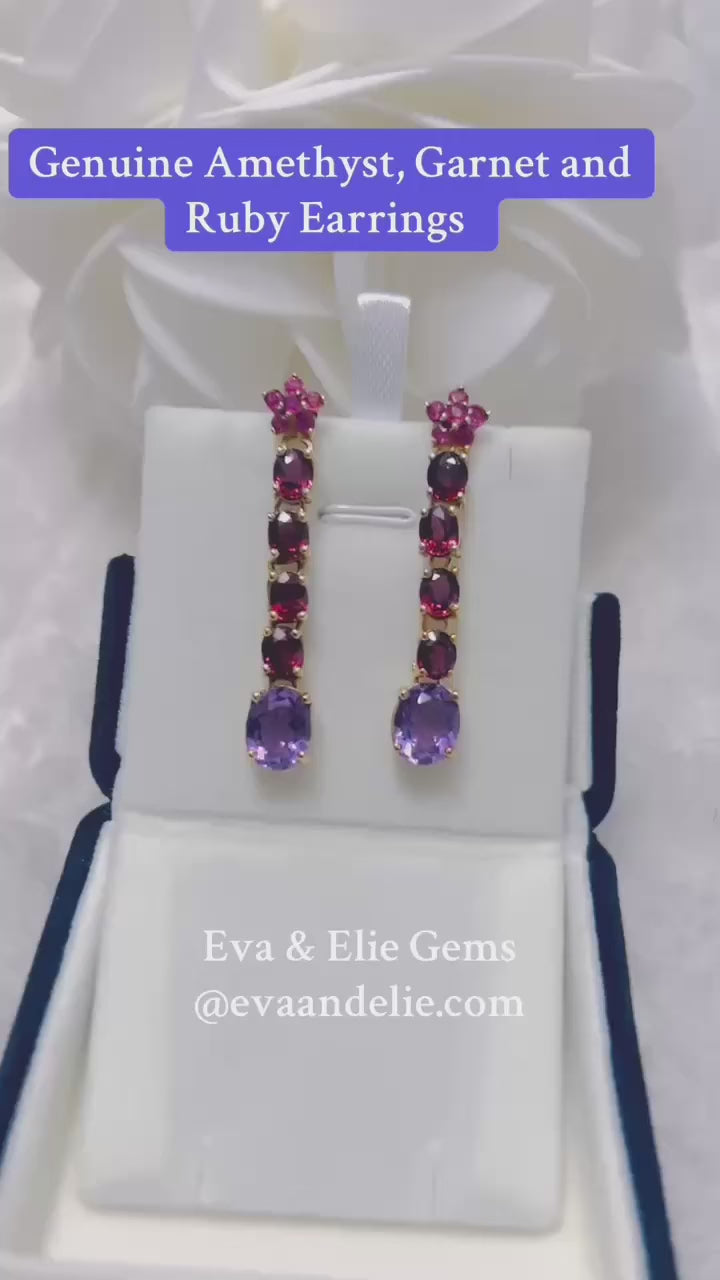  These earrings are set with genuine amethyst, garnet, and ruby gemstones in a beautiful designer drop style.
