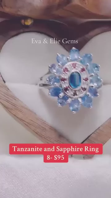  A genuine sterling silver ring with a cluster of natural tanzanite and sapphire stones.