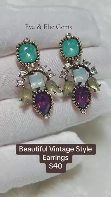  Beautiful vintage-style earrings featuring a unique cluster of multicolored gemstones.