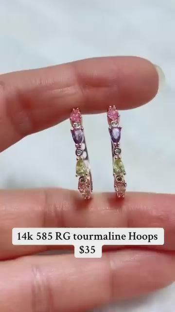 Dainty rose gold hoops featuring a stack of colorful pastel tourmaline gemstones.
