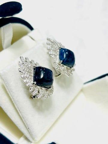 Raw blue cushion sapphire earrings with intricate sterling silver & cubic zirconia in jewelry box.
