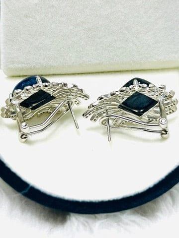 Back view of raw blue sapphire earrings, showing the butterfly backs and intricate silver filigree design.