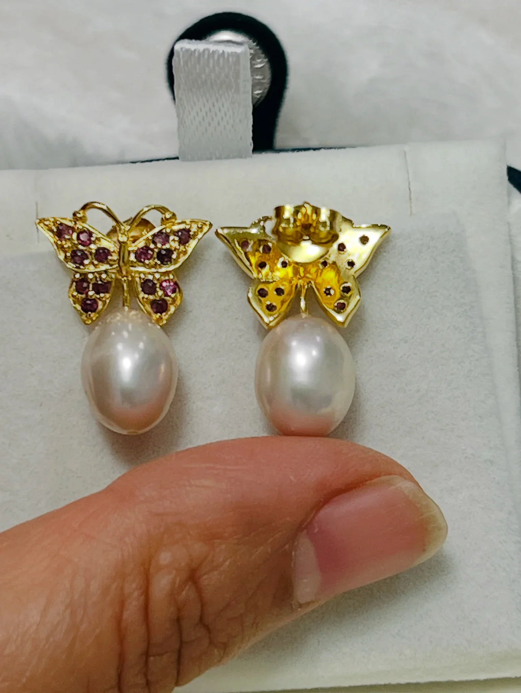 Rhodolite garnet butterfly earrings with front garnet and back pink pearl. 
