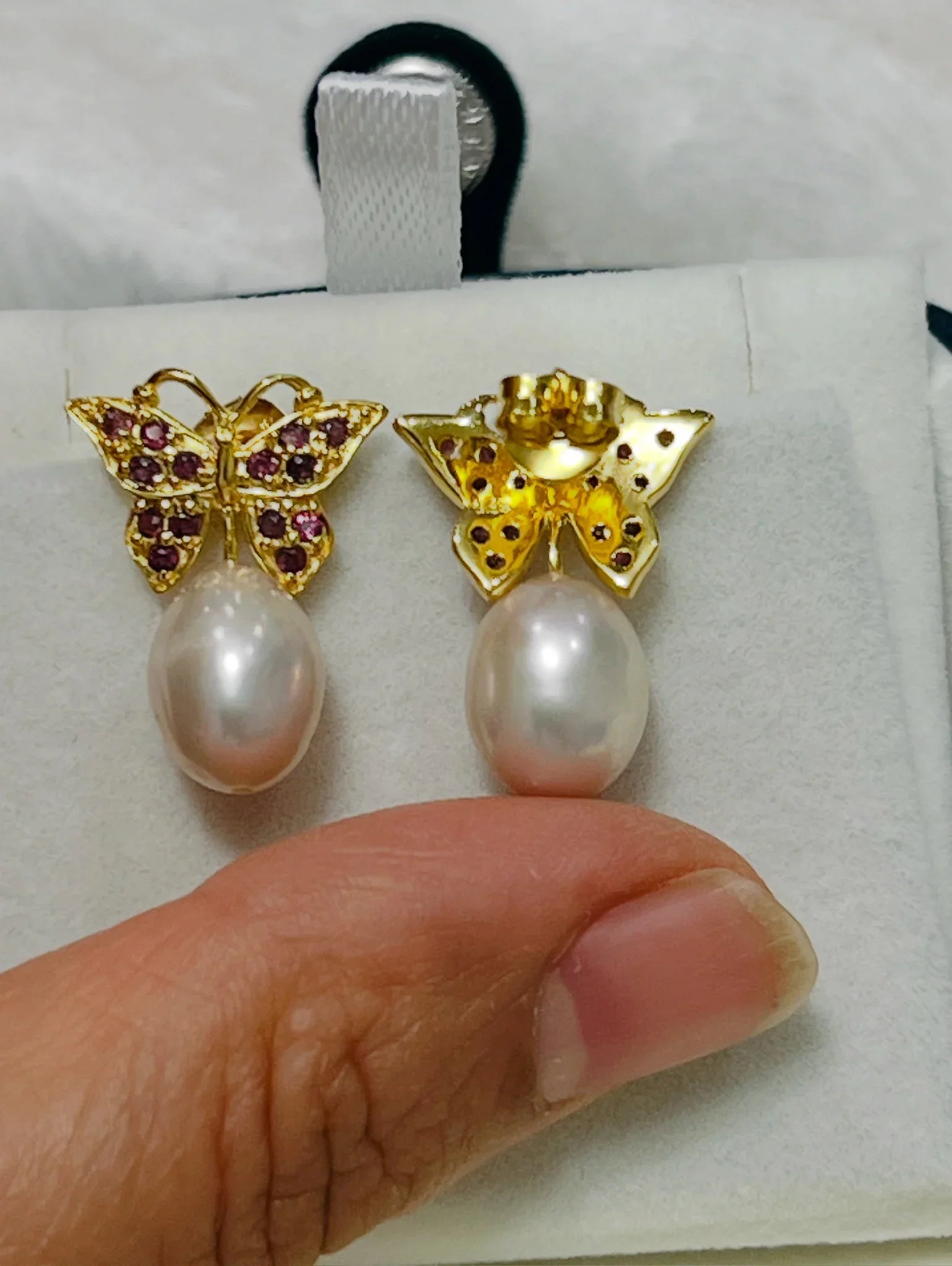 Rhodolite garnet butterfly earrings with front garnet and back pink pearl. 