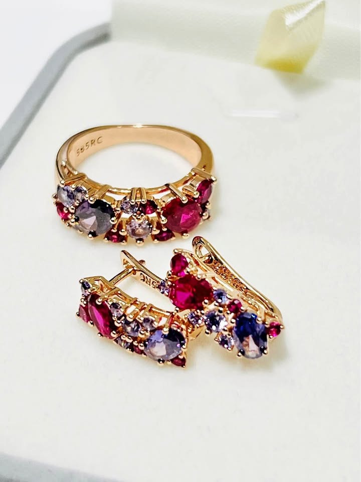 Exquisite 14K rose gold tourmaline ring and matching earrings with vibrant pink and purple stones on a white display.