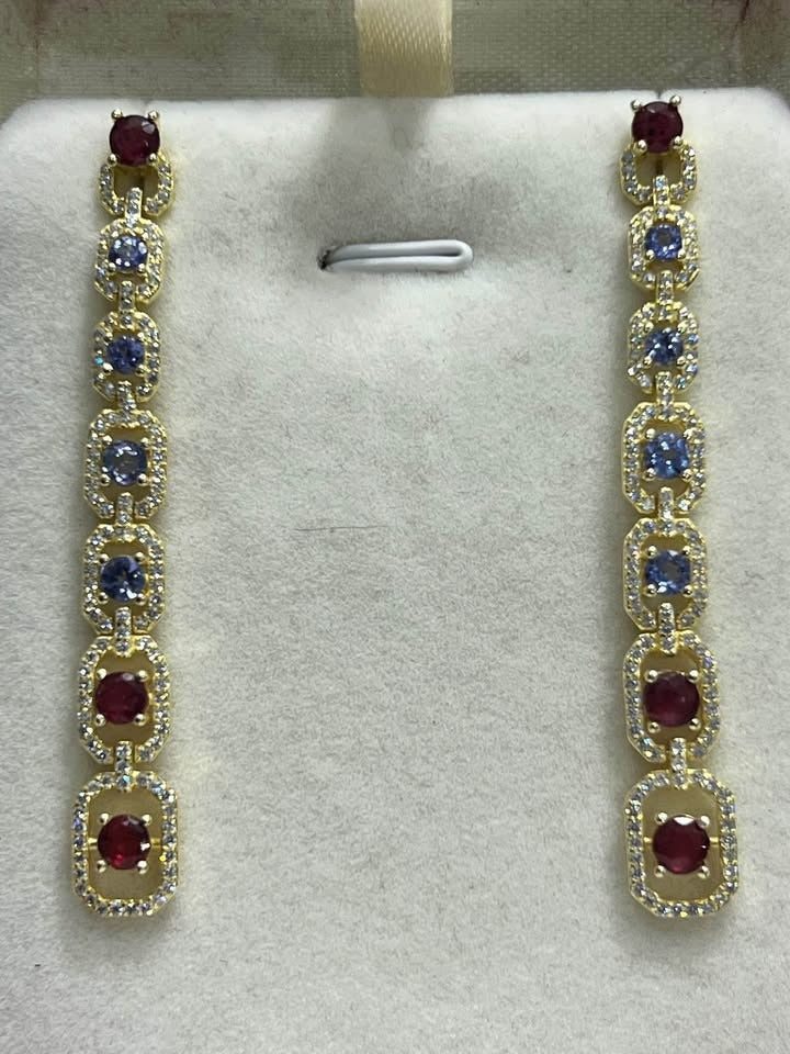 Natural ruby and tanzanite long dangle earrings in sterling silver, featuring sparkling white topaz accents.
