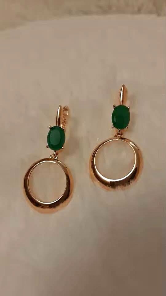 Simple and stylish 14k gold earrings with genuine emeralds and a minimalist circle drop design.