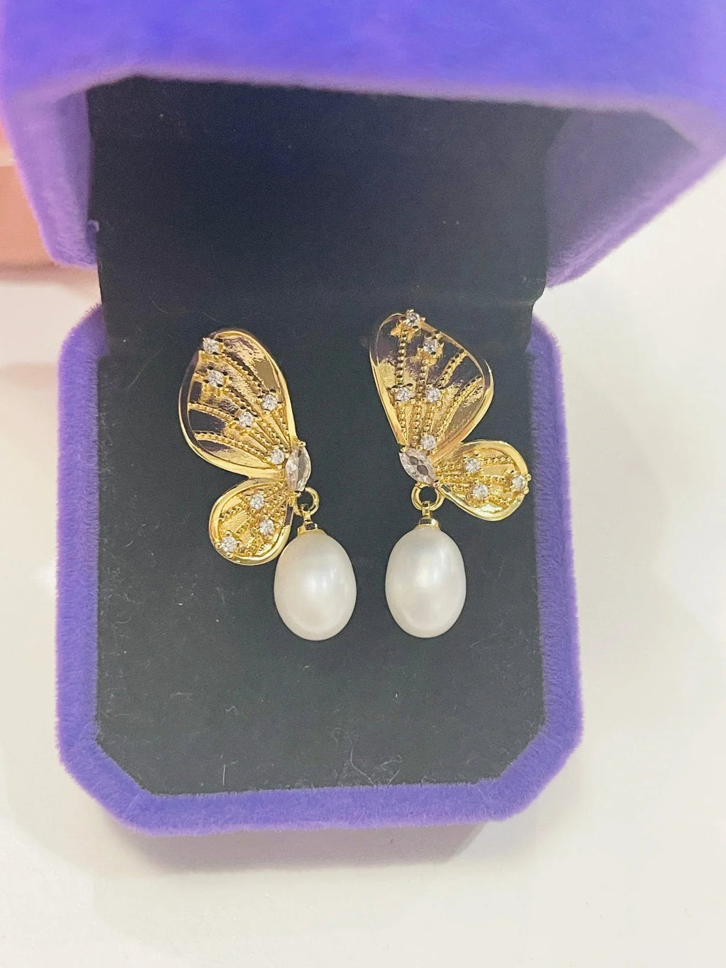 Sterling Silver Gold plated, Butterfly natural Pearl Earrings in jewelry box close up