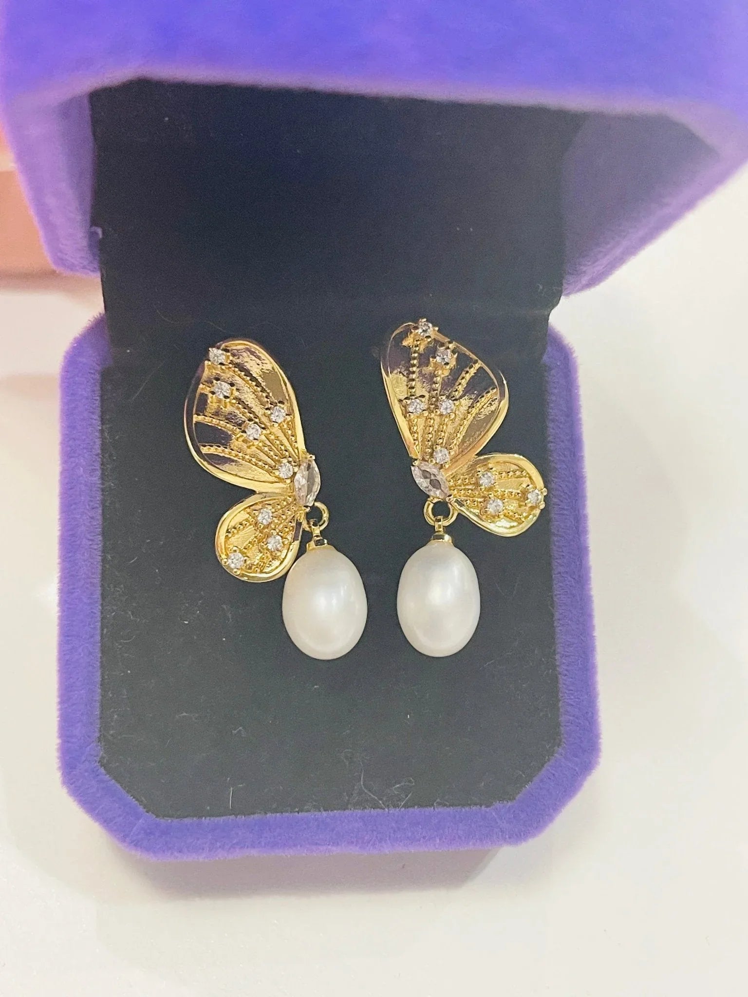 Sterling Silver Gold plated, Butterfly natural Pearl Earrings in jewelry box close up