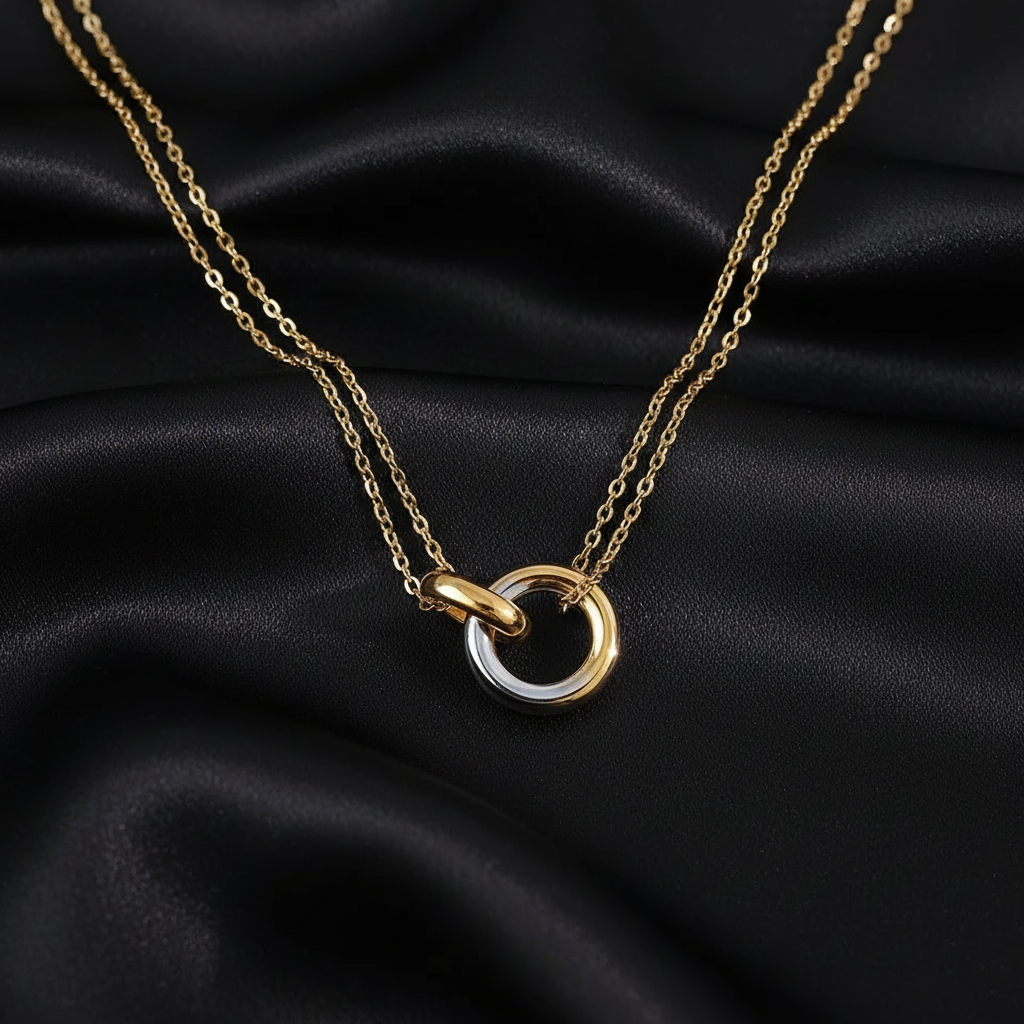 Two-tone necklace on black silk