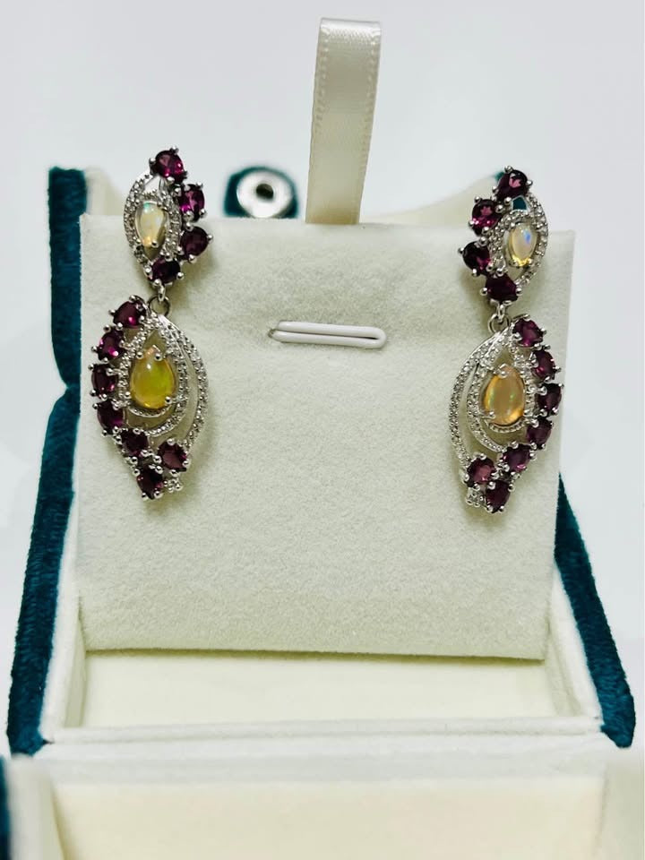 Pair of vintage-inspired fire opal and rhodolite garnet earrings in a gift box.