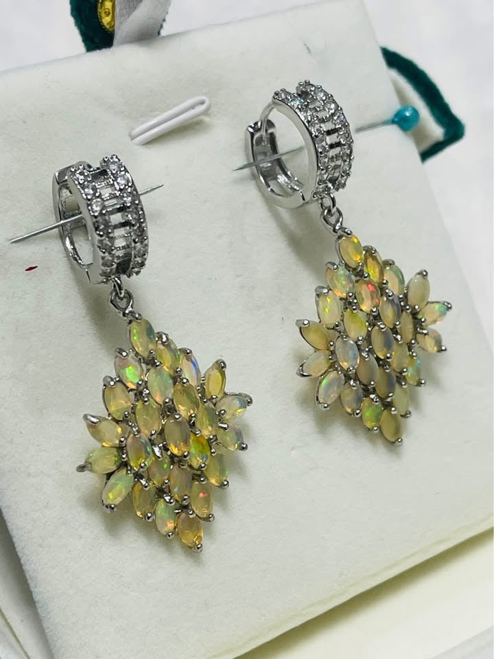 White gold plated earrings with a stunning display of multi-faceted Ethiopian fire opals.