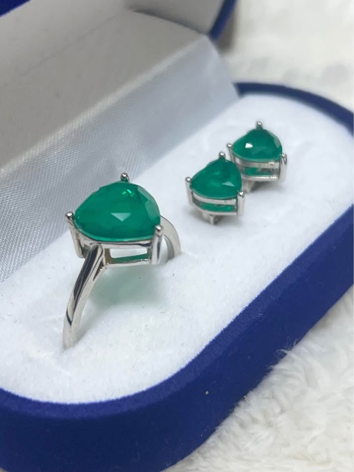 Dainty heart-shaped Zambian emerald ring and earrings in sterling silver, presented in blue box.